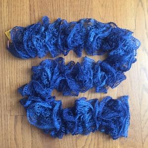 Shimmering cobalt twirled lace scarf.